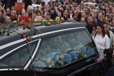 Mourners in Ireland pay their respects to singer Sinéad O'Connor at funeral procession